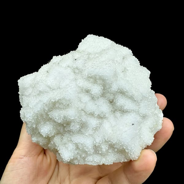 Hollow-shell quartz mass of sparkling white druse from Fujian, China, reverse side