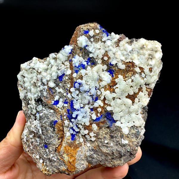 White aragonite balls with royal-blue azurite vein on rusty rock from Yunnan, China