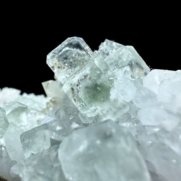 Pale green fluorite cubes with inclusions on white quartz from Guangdong, China, second angle
