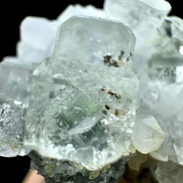 Pale green fluorite cubes with inclusions on white quartz from Guangdong, China, reverse side