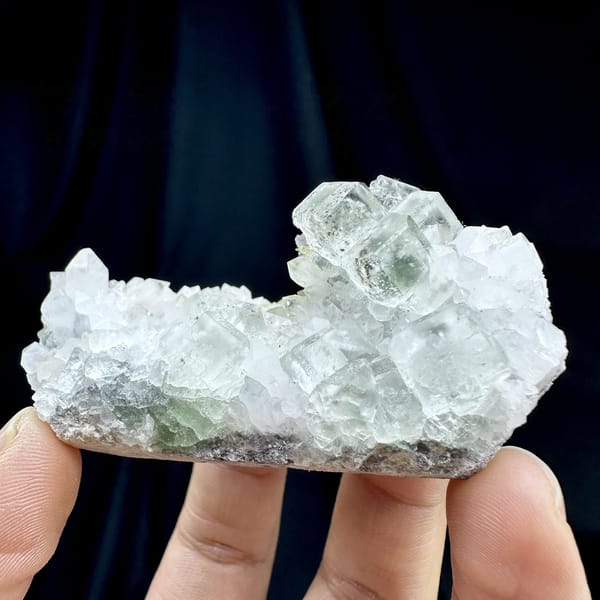 Pale green fluorite cubes with inclusions on white quartz from Guangdong, China, detail of the matrix contact
