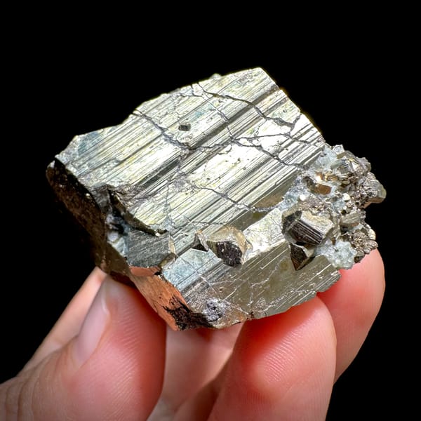 Striated pyrite cube floater with mirror faces from Hunan, China, reverse side