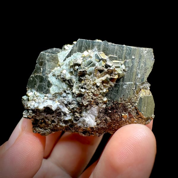 Striated pyrite cube floater with mirror faces from Hunan, China, top view