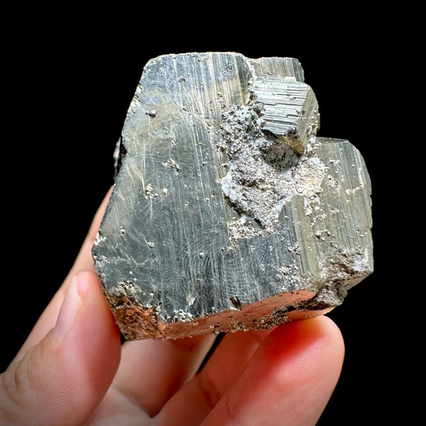 Heavy striated pyrite floater with satin gold lustre from Hunan, China, reverse side