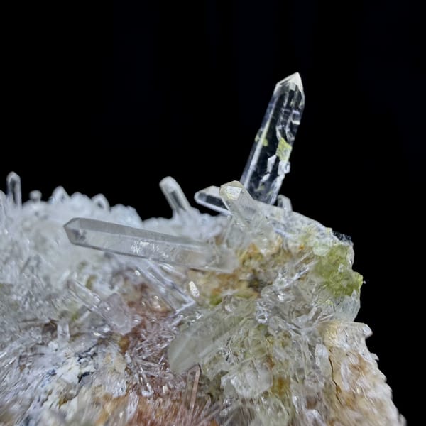 Clear quartz needles bristling over pale base from Guangdong, China, reverse side