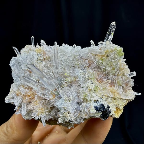 Clear quartz needles bristling over pale base from Guangdong, China, detail of the matrix contact