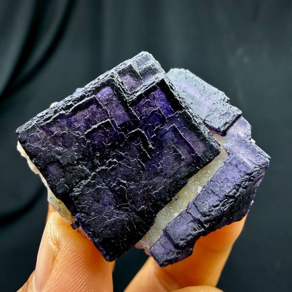 QR-code purple-framed fluorite cube glowing when, from Inner Mongolia, China, close-up of the crystal faces