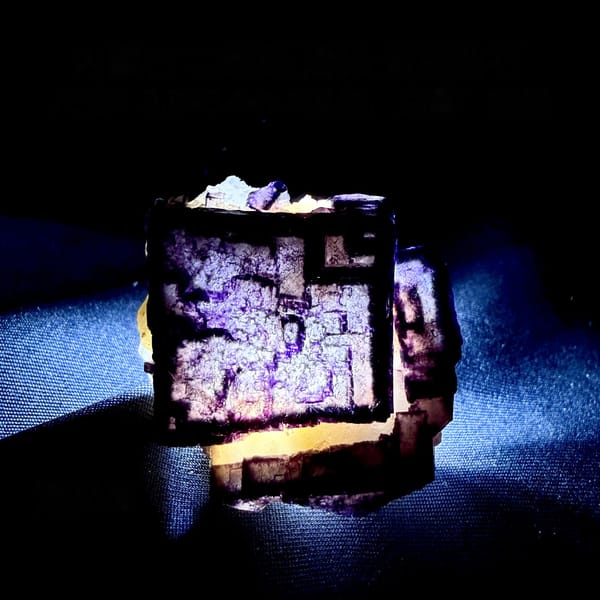 QR-code purple-framed fluorite cube glowing when, from Inner Mongolia, China, detail of the matrix contact