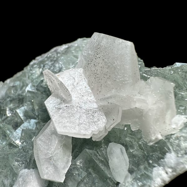 White platy calcite on mint-green fluorite block from Fujian, China, close-up of the crystal faces