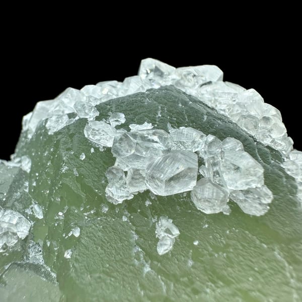 Pale green fluorite balls under white calcite frosting from Fujian, China, reverse side
