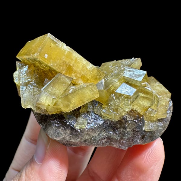 Golden baryte blades on grey base with purple fluorite from Jiangxi, China, second angle