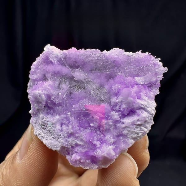 Violet aragonite with clear selenite blades from Yunnan, China, detail of the matrix contact