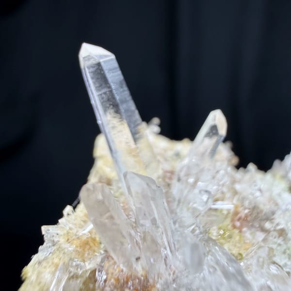 Sunburst of clear quartz needles from Guangdong, China, close-up of the crystal faces