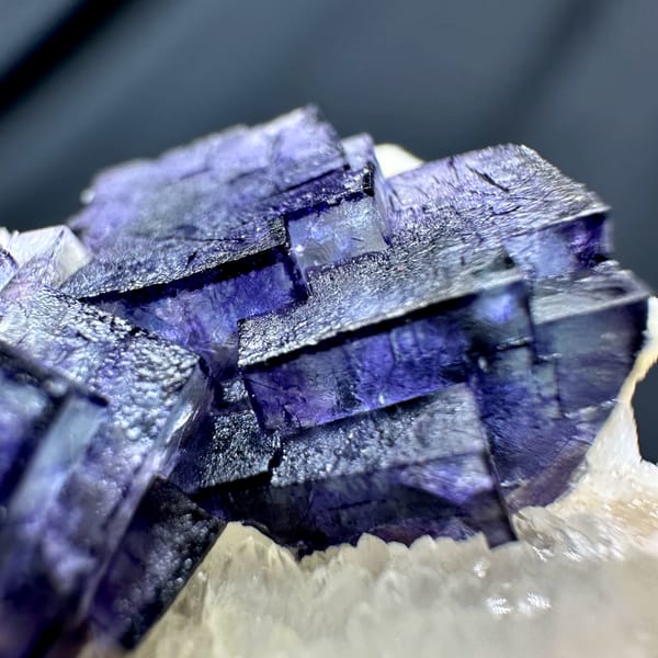 Purple-edged fluorite cubes on white quartz druse from Inner Mongolia, China, reverse side