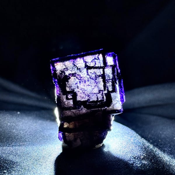 QR-code purple-framed fluorite cube glowing when, from Inner Mongolia, China, detail of the matrix contact