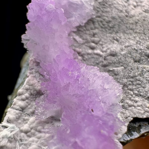Pink aragonite band across pale grey matrix from Yunnan, China, reverse side