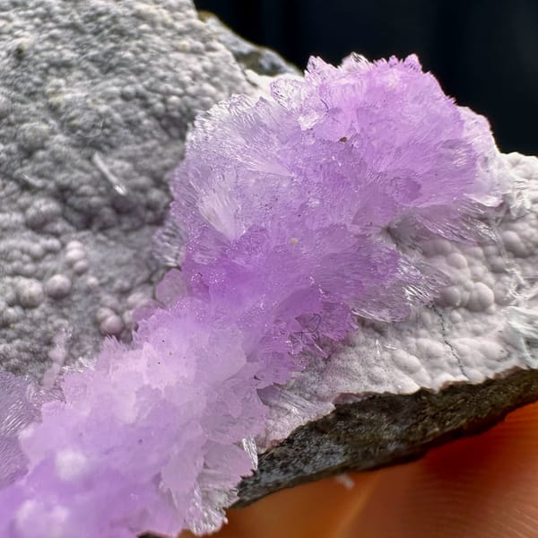 Pink aragonite band across pale grey matrix from Yunnan, China, top view