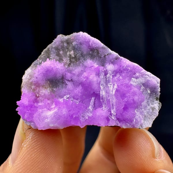 Vivid violet aragonite with clear gypsum blade from Yunnan, China, second angle
