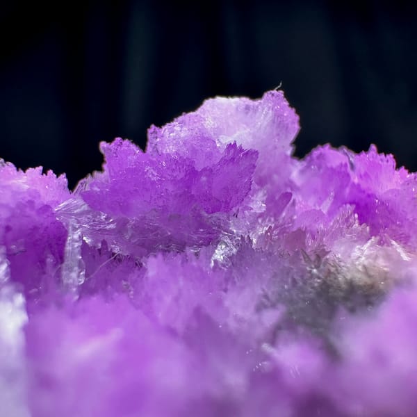 Vivid violet aragonite with clear gypsum blade from Yunnan, China, top view