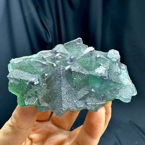 Translucent mint-green octahedral fluorite plate with purple edges from Zhejiang, China, second angle