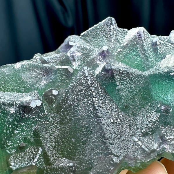 Translucent mint-green octahedral fluorite plate with purple edges from Zhejiang, China, reverse side