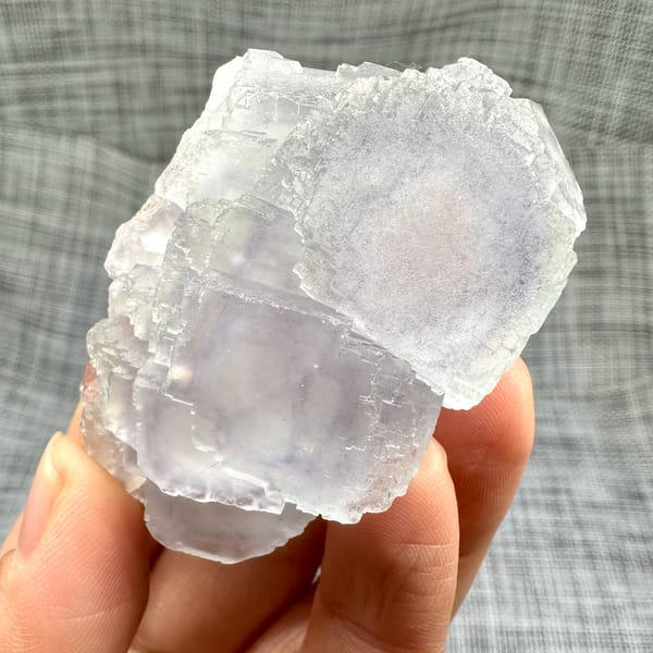 Large purple-framed fluorite crystal with frosted skin from Guangxi, China, second angle