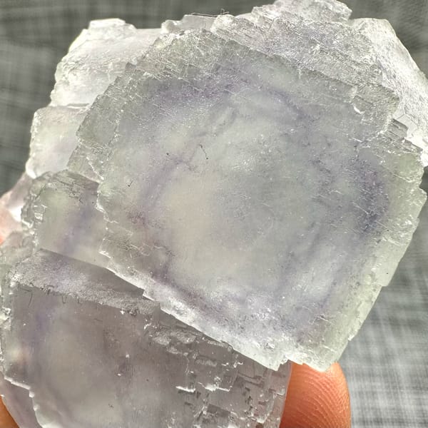 Large purple-framed fluorite crystal with frosted skin from Guangxi, China, reverse side