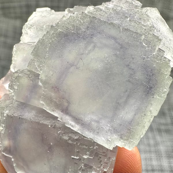 Large purple-framed fluorite crystal with frosted skin from Guangxi, China, another angle