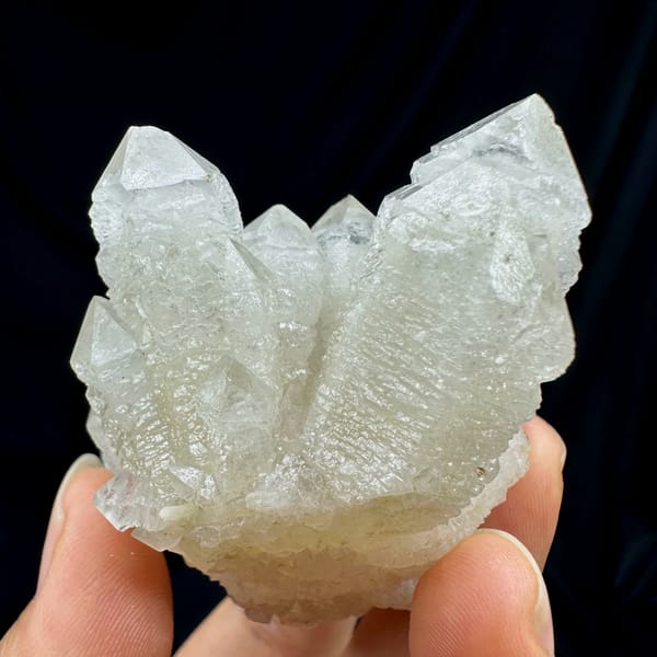 White skeletal quartz crystals with calcite from Inner Mongolia, China, close-up of the crystal faces