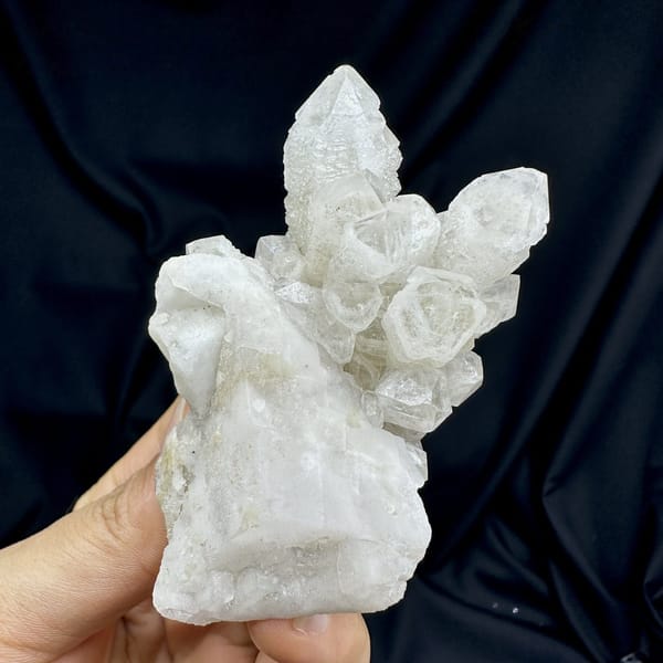 White skeletal quartz crystals with calcite from Inner Mongolia, China, detail of the matrix contact