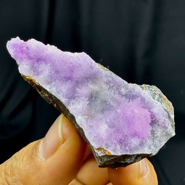 Sparkling magenta aragonite on dark wedge from Yunnan, China, second angle