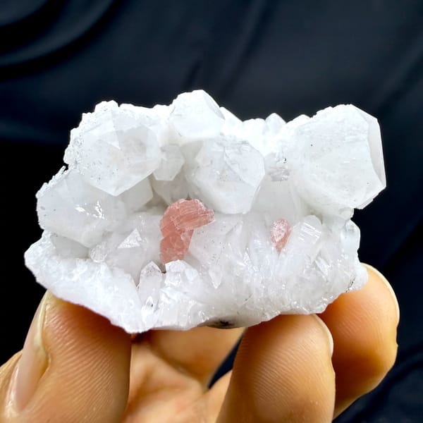 Pink rhodochrosite patch inside white quartz cluster from Guangxi, China, second angle