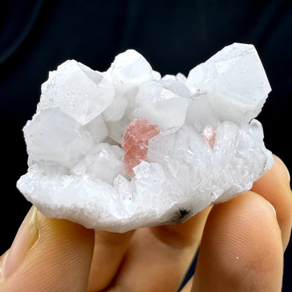 Pink rhodochrosite patch inside white quartz cluster from Guangxi, China, top view