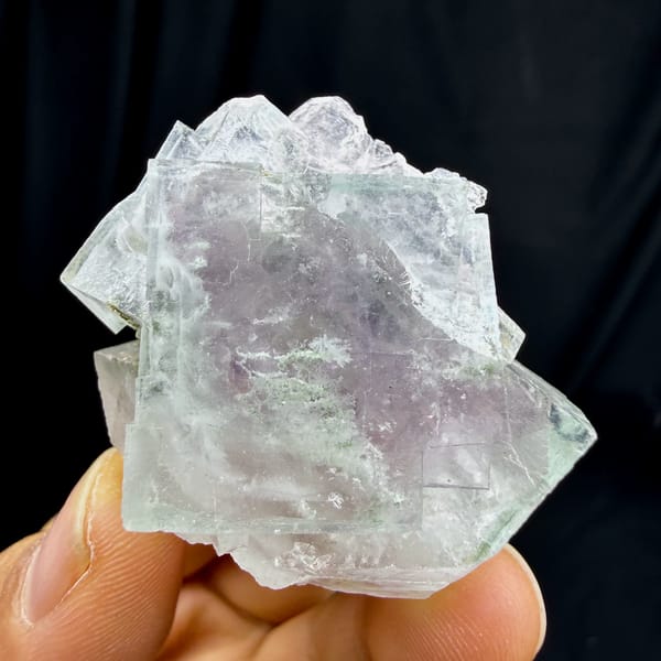 Transparent purple fluorite cubes with snowflake inclusions from Yaogangxian Mine, Hunan, close-up of the crystal faces