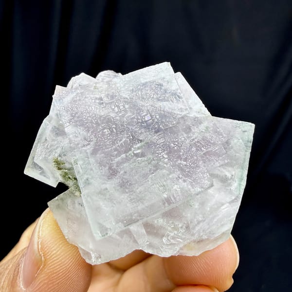 Transparent purple fluorite cubes with snowflake inclusions from Yaogangxian Mine, Hunan, China, detail of the matrix contact