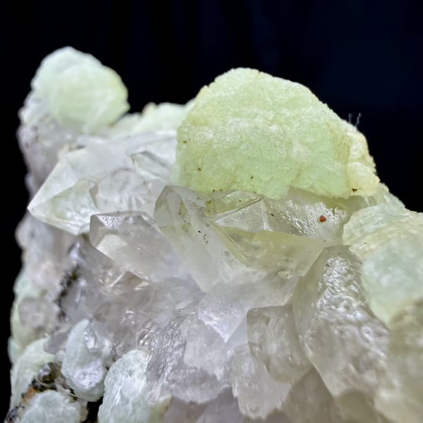 Mint-green prehnite balls with epidote and quartz from Sichuan, China, close-up of the crystal faces