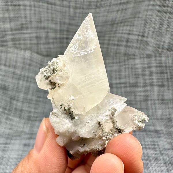 Tall translucent calcite scalenohedron from Inner Mongolia, China, close-up of the crystal faces