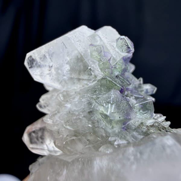 Large double-terminated calcite with green fluorite octahedra from Fujian, China, close-up of the crystal faces
