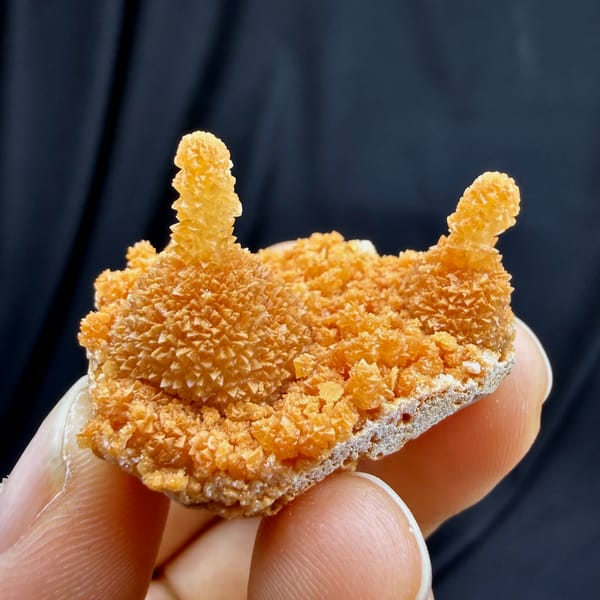 Orange stalactitic calcite crown with sugary skin from Yunnan, China, second angle
