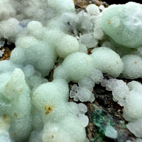 Pastel blue aragonite balls with malachite and azurite from Yunnan, China, reverse side