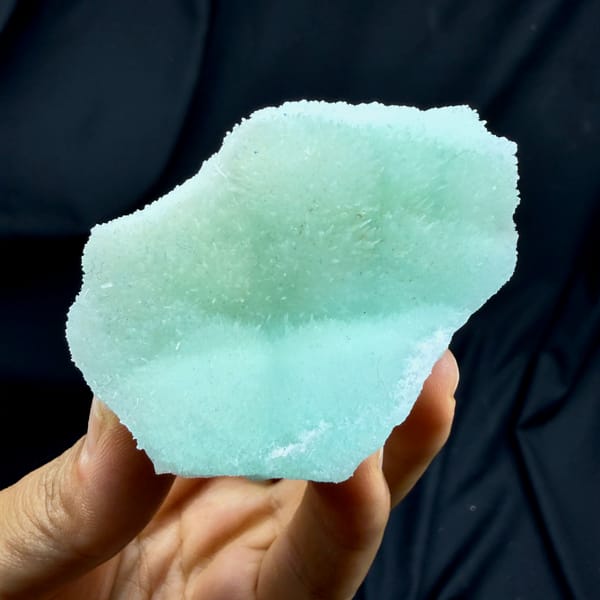Flat aqua-green acicular aragonite plate from Yunnan, China, close-up of the crystal faces