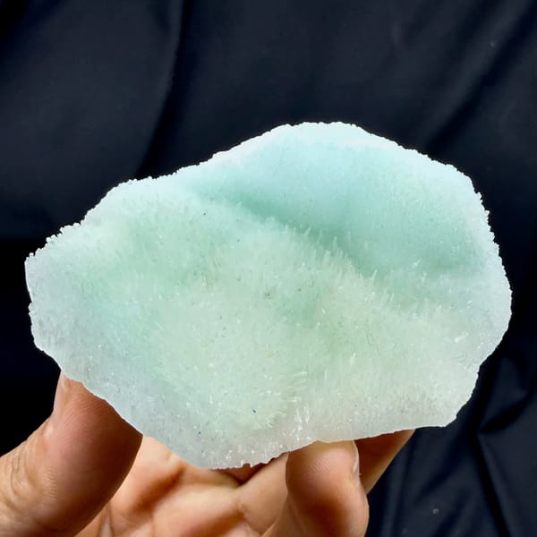 Flat aqua-green acicular aragonite plate from Yunnan, China, reverse side