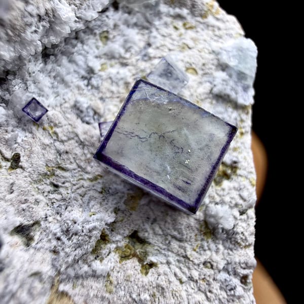 Purple-framed clear fluorite cubes on grey quartz from Inner Mongolia, China, reverse side