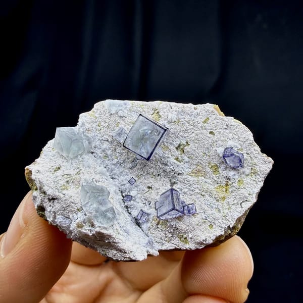 Purple-framed clear fluorite cubes on grey quartz from Inner Mongolia, China, top view