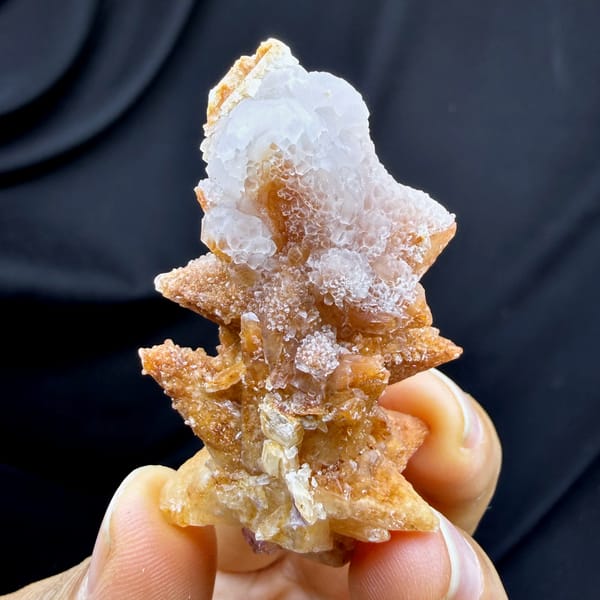 Purple-red fluorite cubes between tan calcite blades from Yunnan, China, reverse side