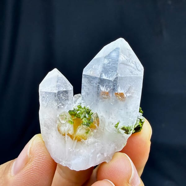 Two clear quartz points with epidote cluster from Sichuan, China, second angle