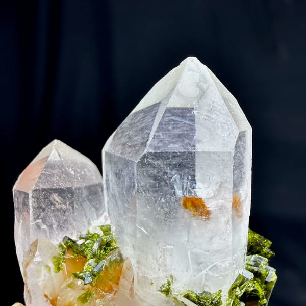 Two clear quartz points with epidote cluster from Sichuan, China, top view