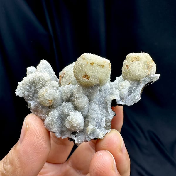 Hollow gumdrop fluorite balls with quartz from Inner Mongolia, China, close-up of the crystal faces