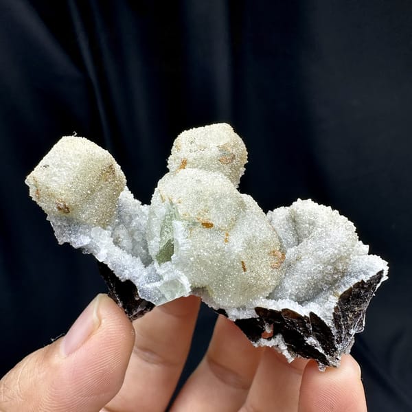 Hollow gumdrop fluorite balls with quartz from Inner Mongolia, China, detail of the matrix contact