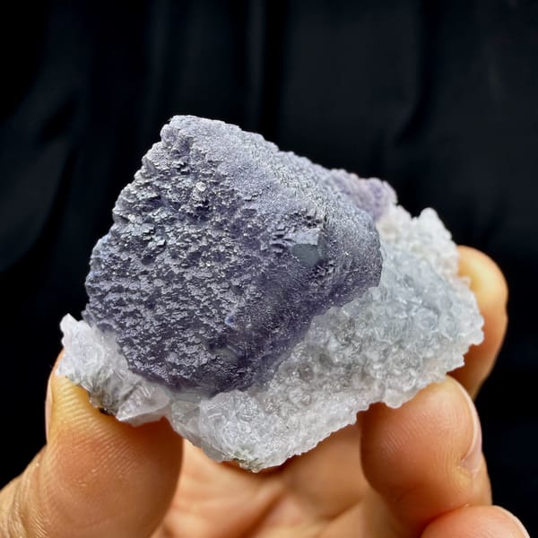 Frosted purple fluorite cube on sparkling white quartz from Fujian, China, top view